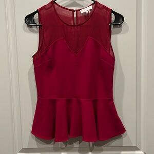 Magenta top with cut outs, sheer and ruffled hem